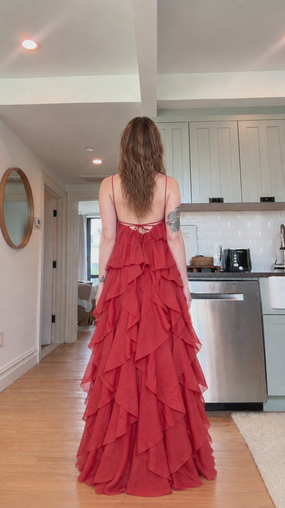 Back view showcasing strappy lace-up back on rust red tiered ruffle dress