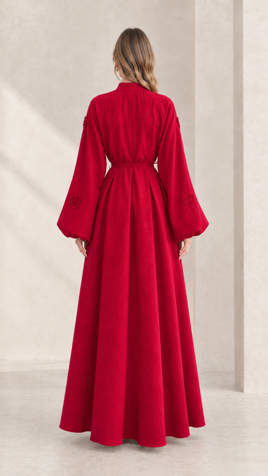 Back view of model showcasing the fluid drape of the red lantern sleeve maxi dress