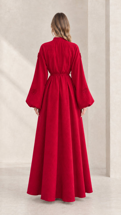 Back view of model showcasing the fluid drape of the red lantern sleeve maxi dress