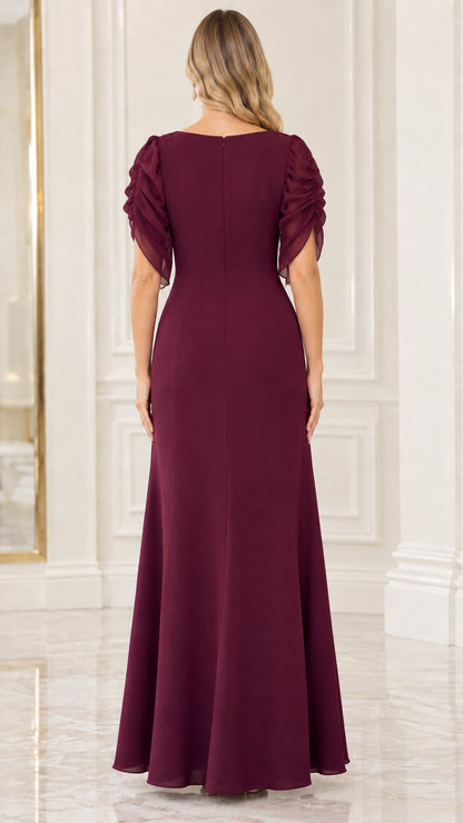 Back view of model in burgundy floor-length maxi dress showing smooth back fit