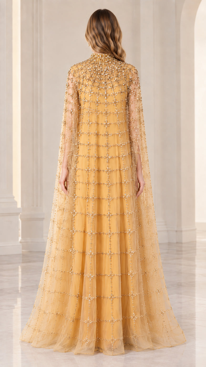 Back full view of woman wearing gold beaded cape formal dress