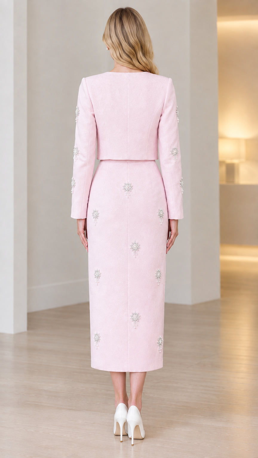Back view of light pink long sleeve formal two-piece midi set