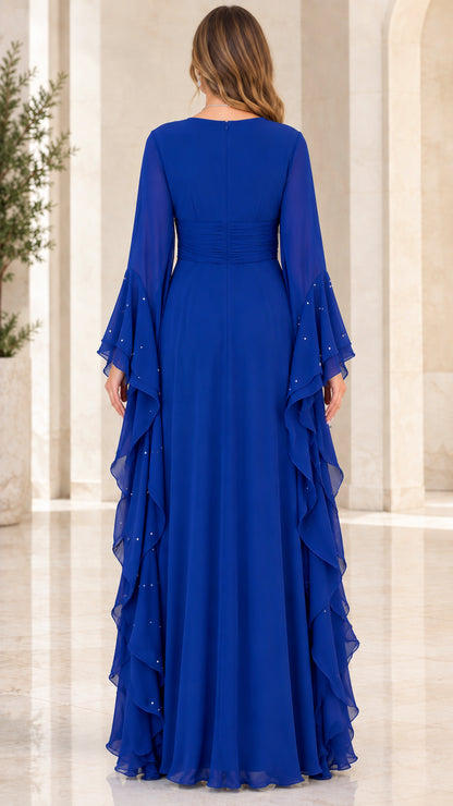 Back view of woman wearing Royal Blue floor-length chiffon gown with bell sleeves