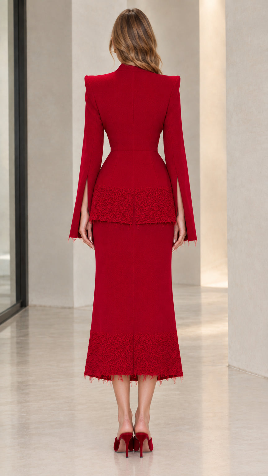 Back view of woman wearing red peplum blazer and lace-trimmed midi skirt