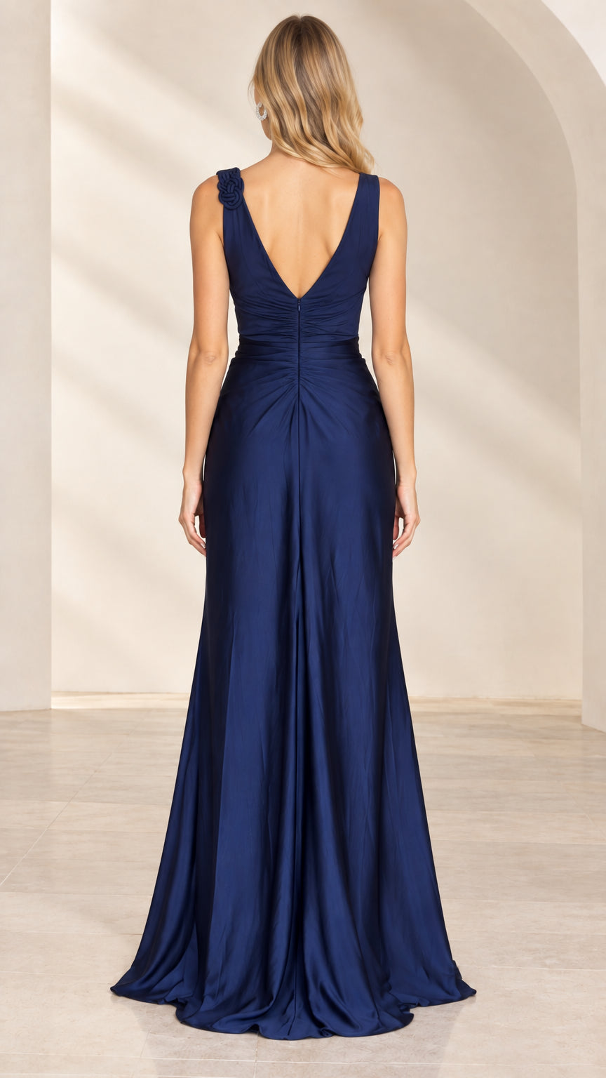Back view of model wearing Navy Blue V-back satin evening gown