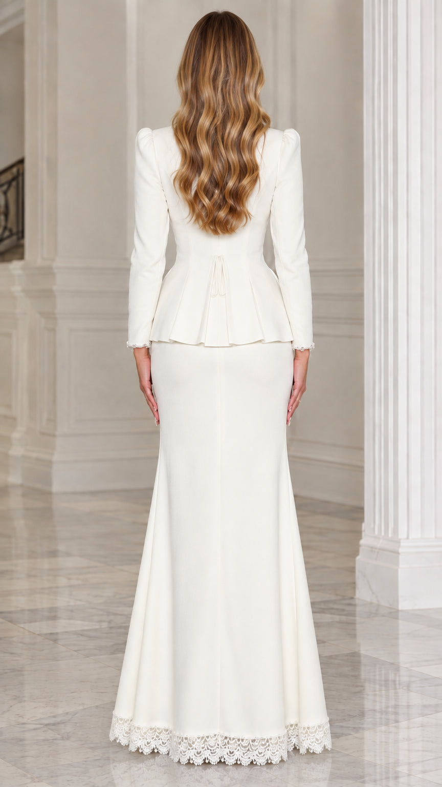 Back view of woman wearing white peplum jacket and trumpet maxi skirt
