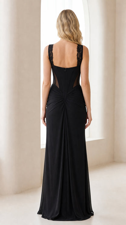 Back view of black lace corset maxi gown with sheer back panel