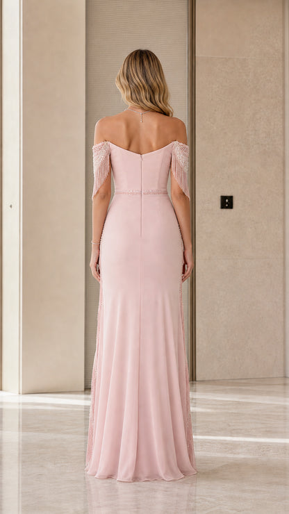 Back view of dusty rose maxi gown showing fitted bodice and flowing hemline