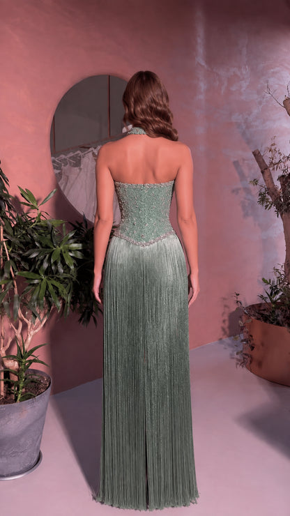 Back view of model showing open back and fringe detail in Sage Green dress