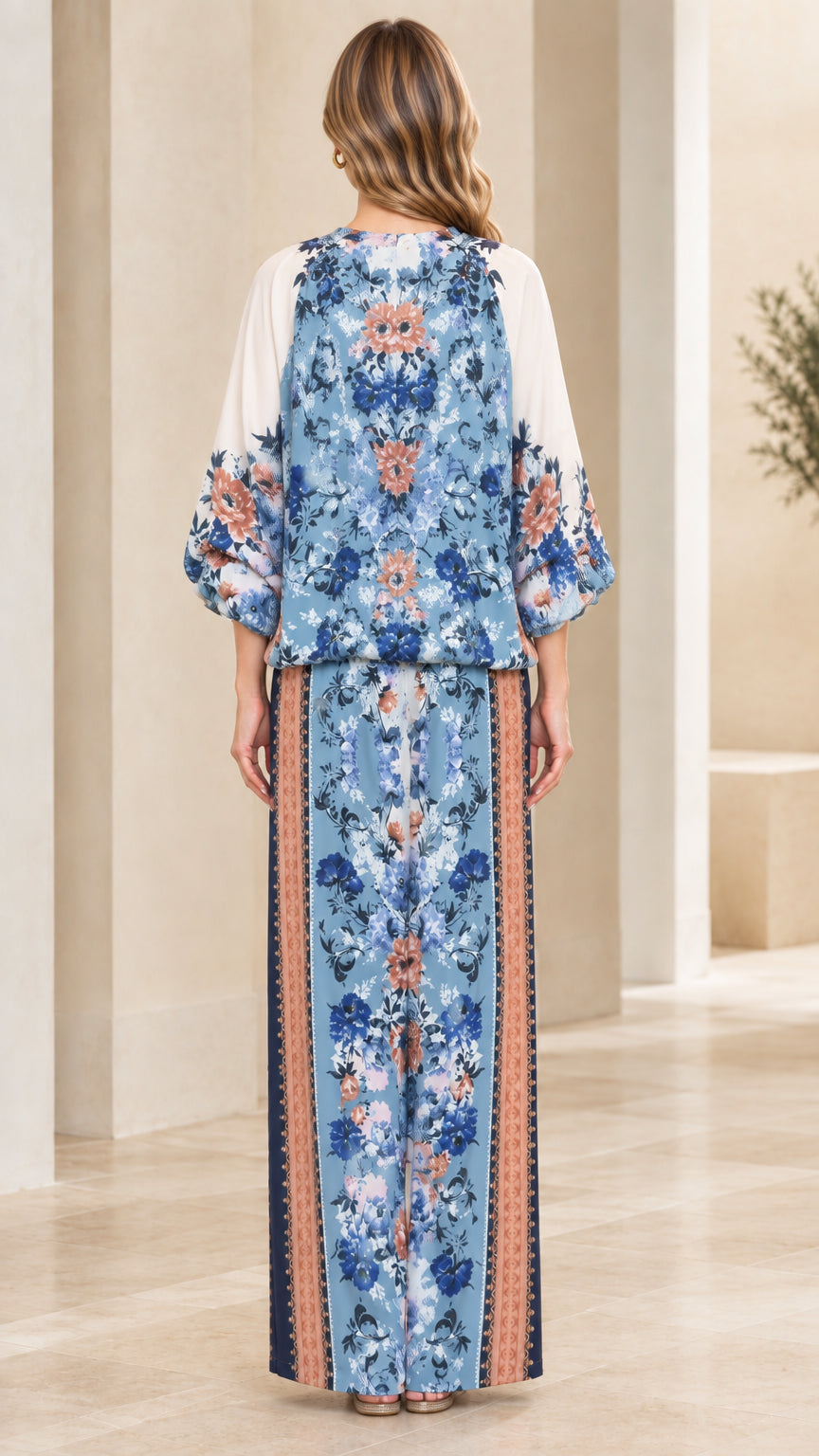 Back view of model wearing Light Blue floral matching set with wide-leg trousers