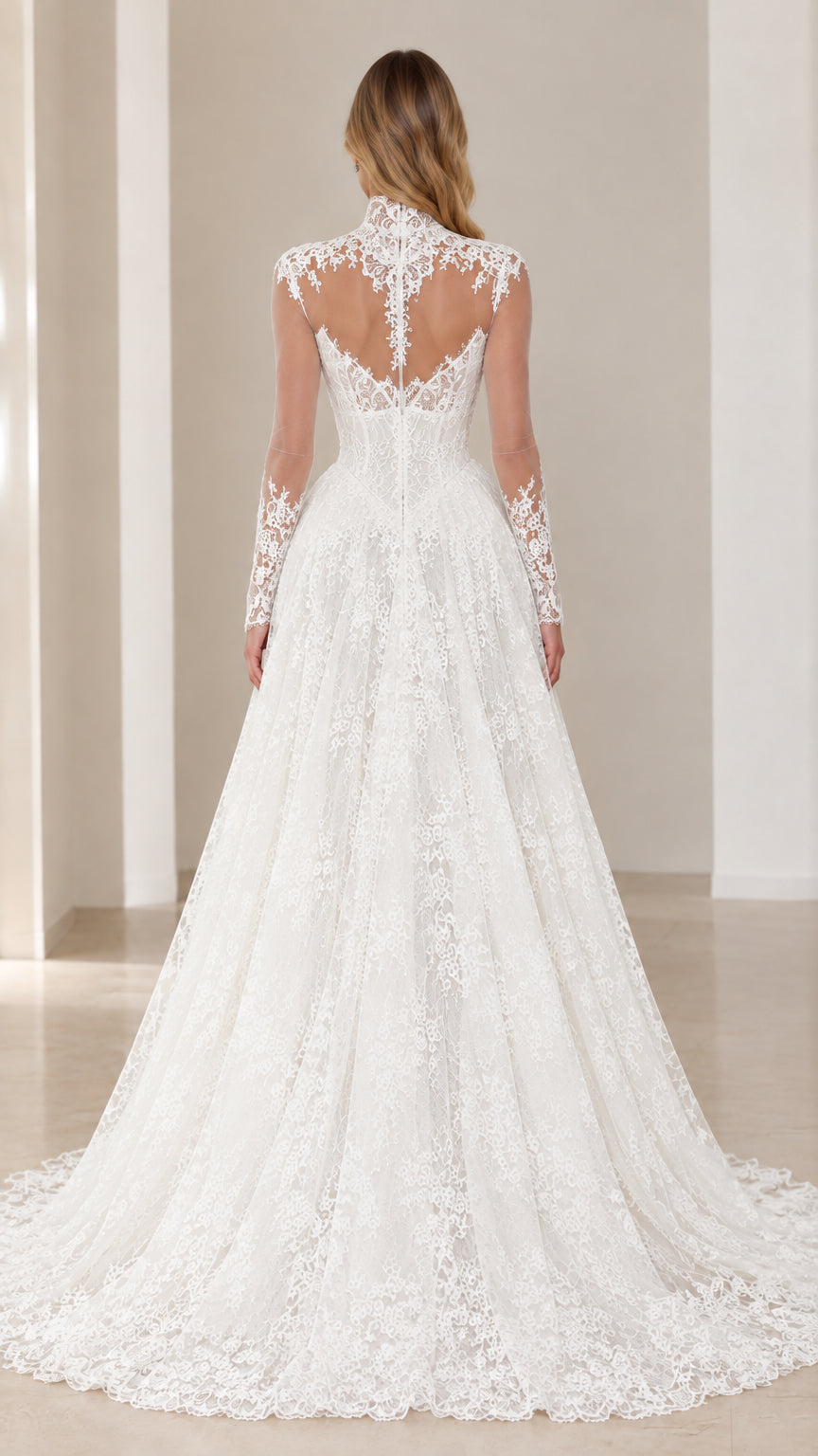 Back view of model showcasing the sheer illusion lace back and train of the White gown