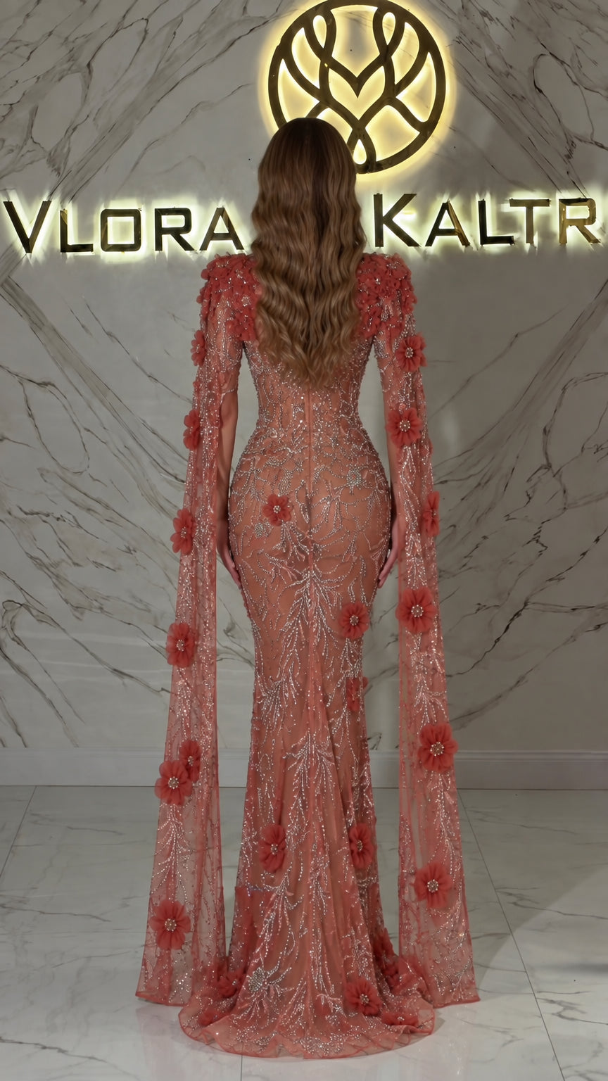 Back view of Dusty Rose long evening dress with dramatic floor-length floral cape sleeves