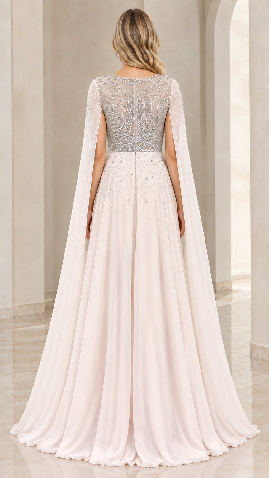 Back view of Champagne beaded bodice and flowing cape gown