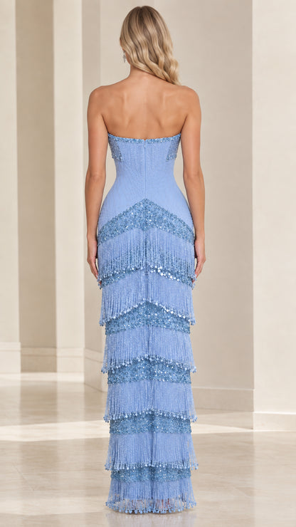 Back view of sky blue strapless floor-length tiered fringe formal dress