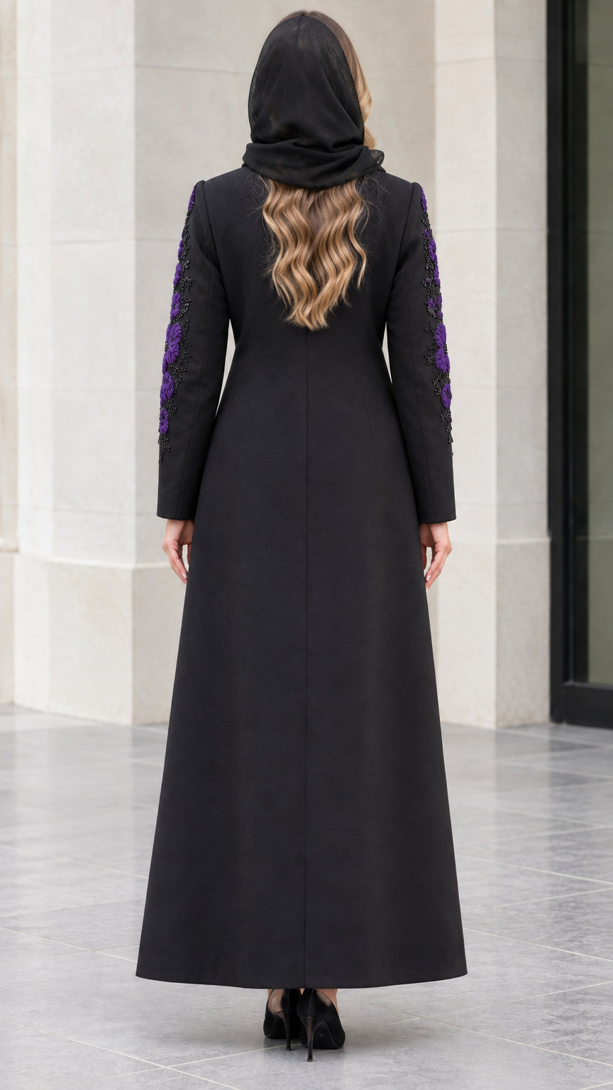 Back view of black tailored full-length coat showing A-line silhouette