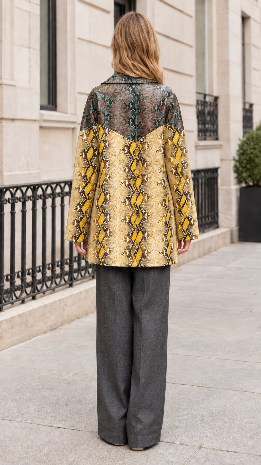 Back view of model wearing Teal Yellow snakeskin outerwear