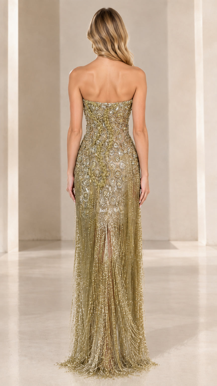 Back view of strapless champagne gold floor-length beaded gown