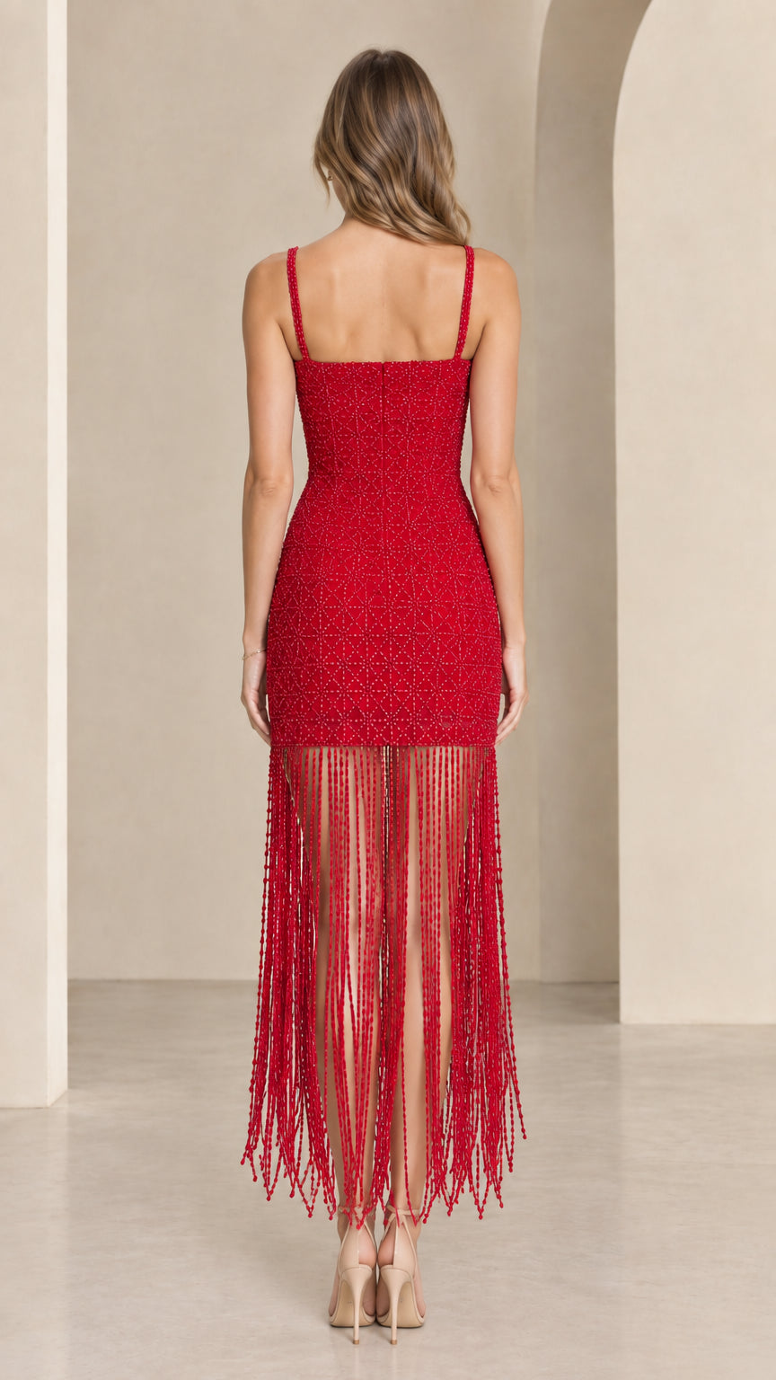 Back view of red beaded bodycon midi dress showing square back neckline and fringe skirt