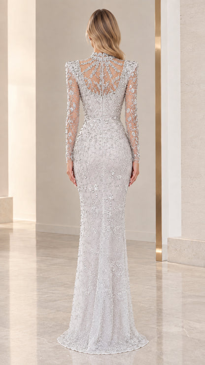 Back view of silver high neck illusion evening gown with sheer back panel