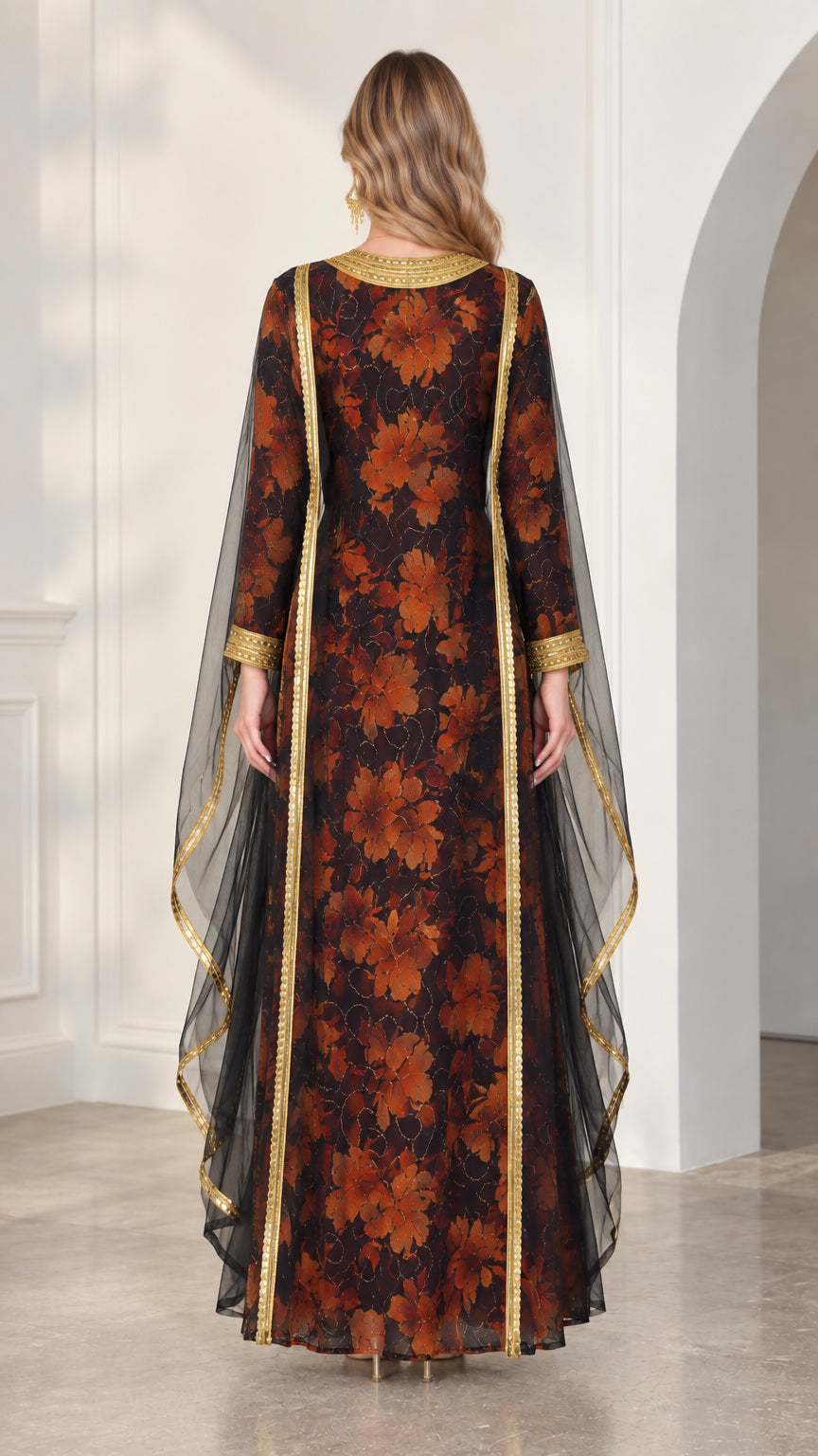 Back view of model in black floral maxi kaftan showcasing flowing sheer overlay