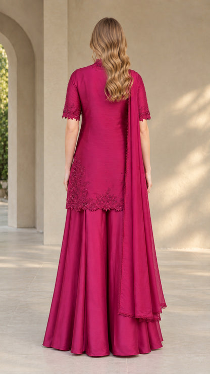 Back view of model wearing magenta tunic and wide palazzo pants