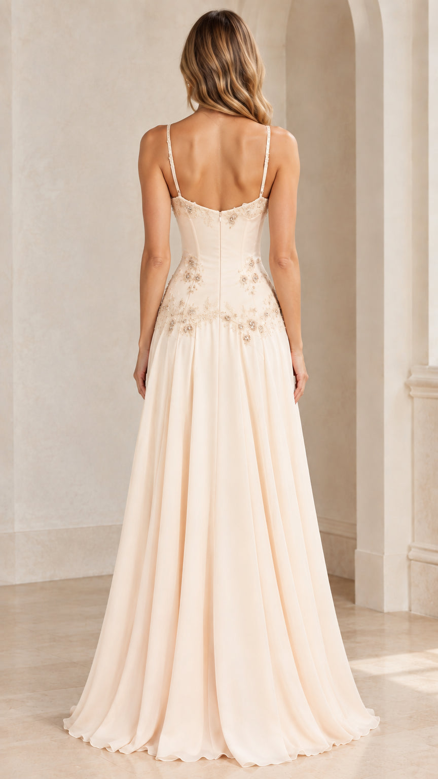Back view of champagne formal evening dress showing fitted corset back and flowing skirt