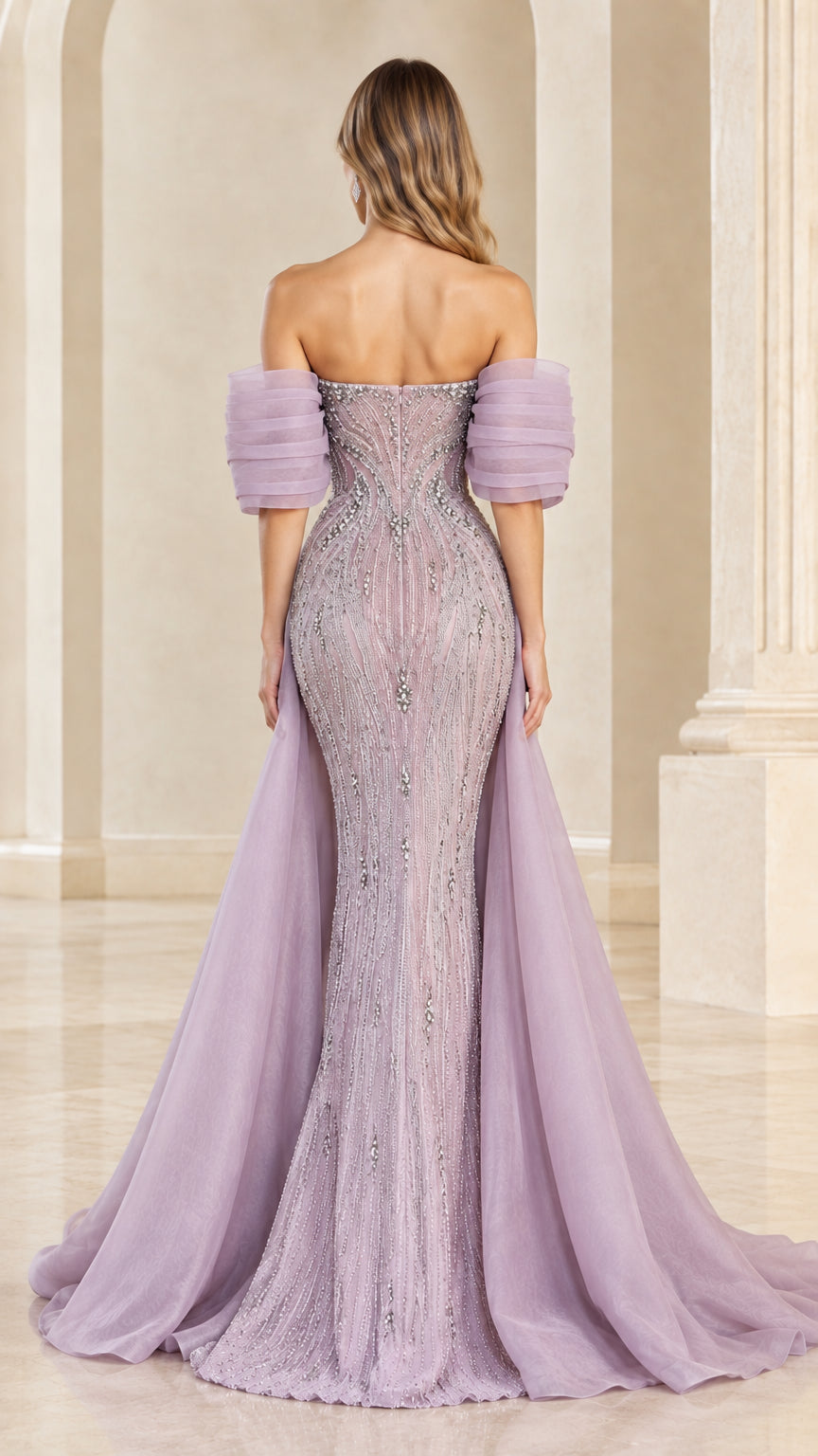 Back view of lavender off-the-shoulder mermaid gown with sheer back and flowing train