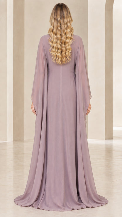 Back view of dusty mauve flowing chiffon cape gown