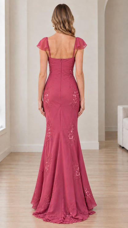 Back view of woman in Dusty Rose formal evening dress with square back and sweeping hem