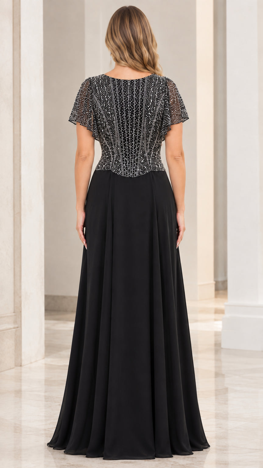 Back view of black embellished evening dress with scoop back