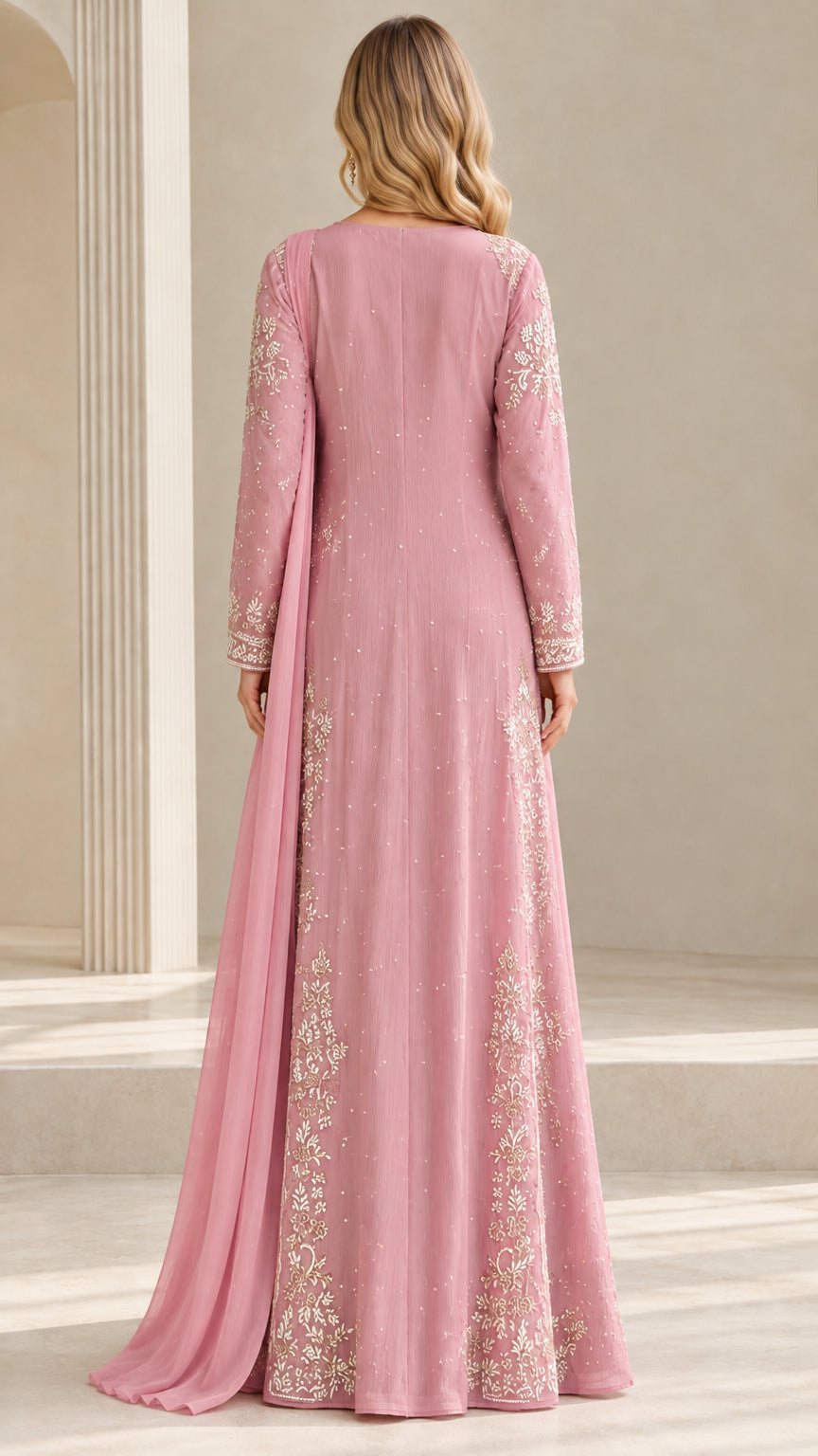 Back view of dusty rose embroidered gown highlighting full coverage and elegant cut