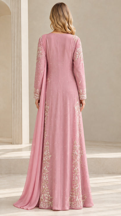 Back view of dusty rose embroidered gown highlighting full coverage and elegant cut