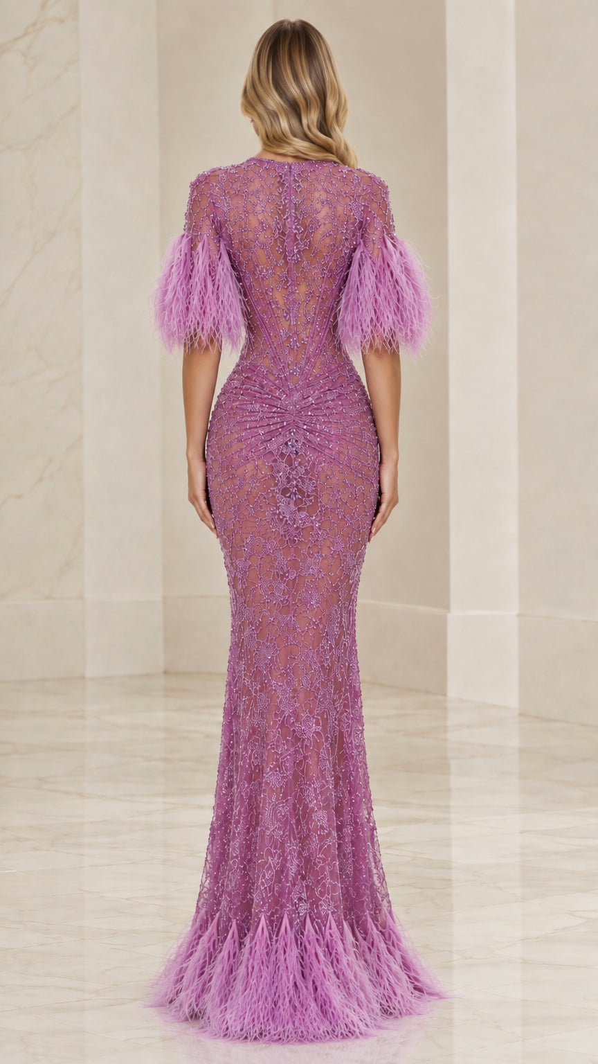 Back view of model in a lilac lace evening gown with feather trims