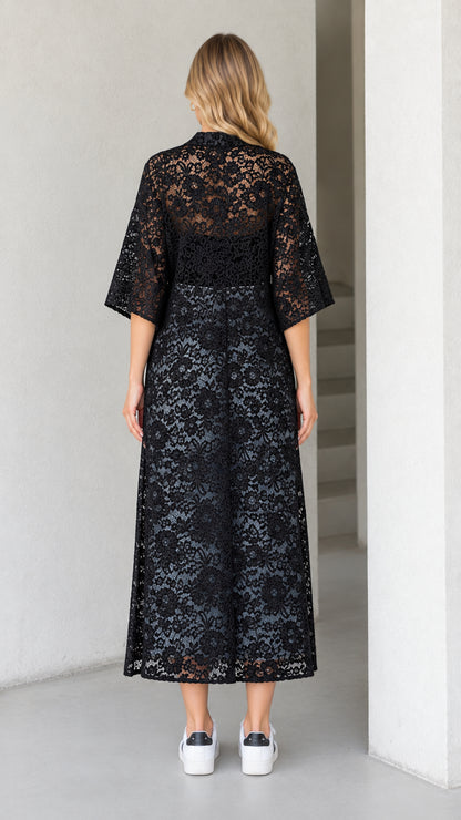Back view of black lace midi duster showing sheer textured floral pattern