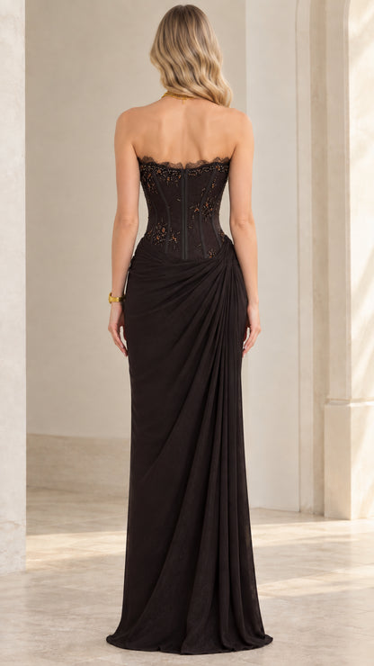 Back view of model in black strapless corset evening gown