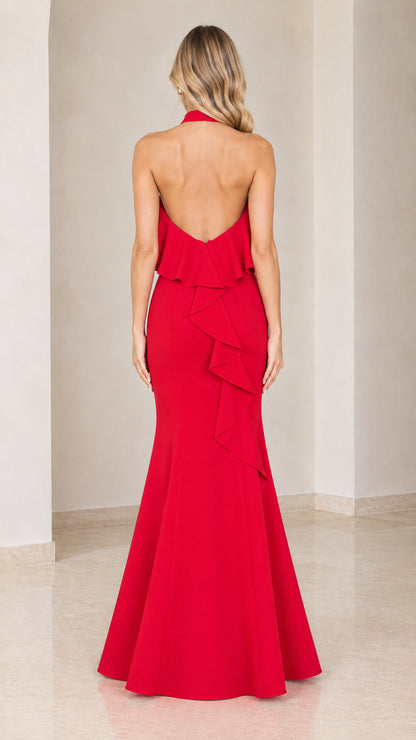 Back view of red maxi dress showing open back and cascading ruffle detail