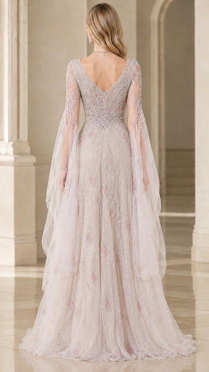 Back view of champagne formal gown showing deep V-back and floor-length skirt drape