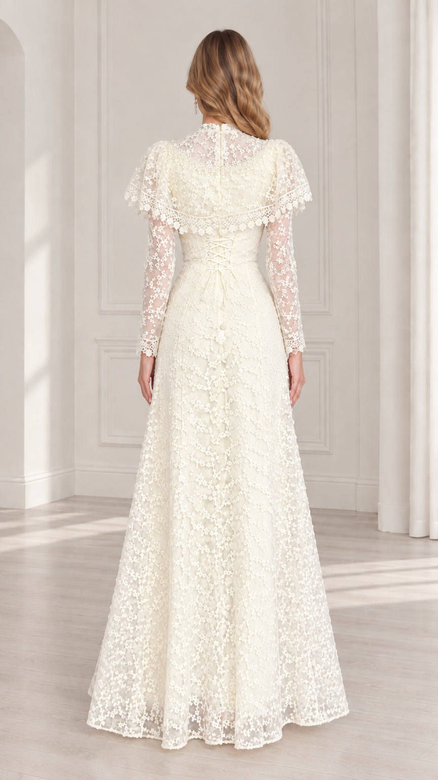 Back view of ivory lace evening maxi gown with ruffled capelet