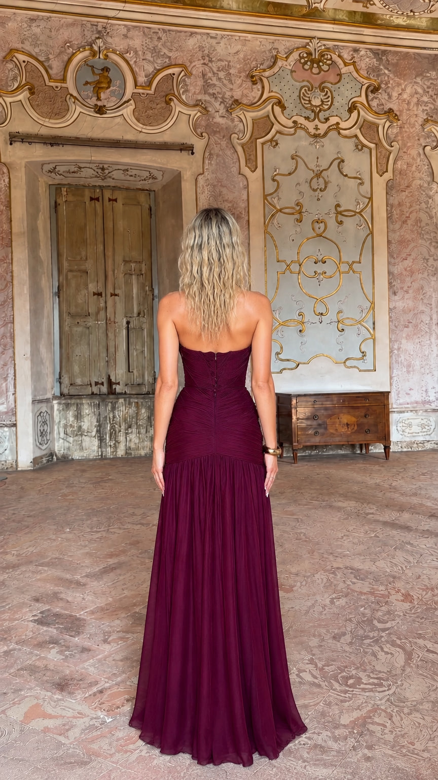 Back view of burgundy pleated evening gown with concealed zipper