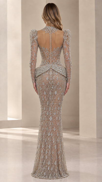 Back view of sheer illusion back silver crystal mermaid evening gown