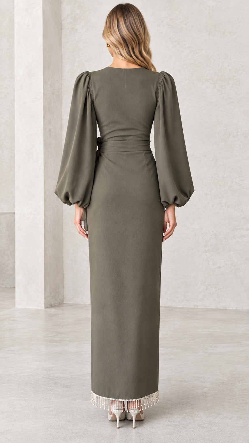 Back view of olive green long sleeve formal maxi dress featuring sleek back zipper closure