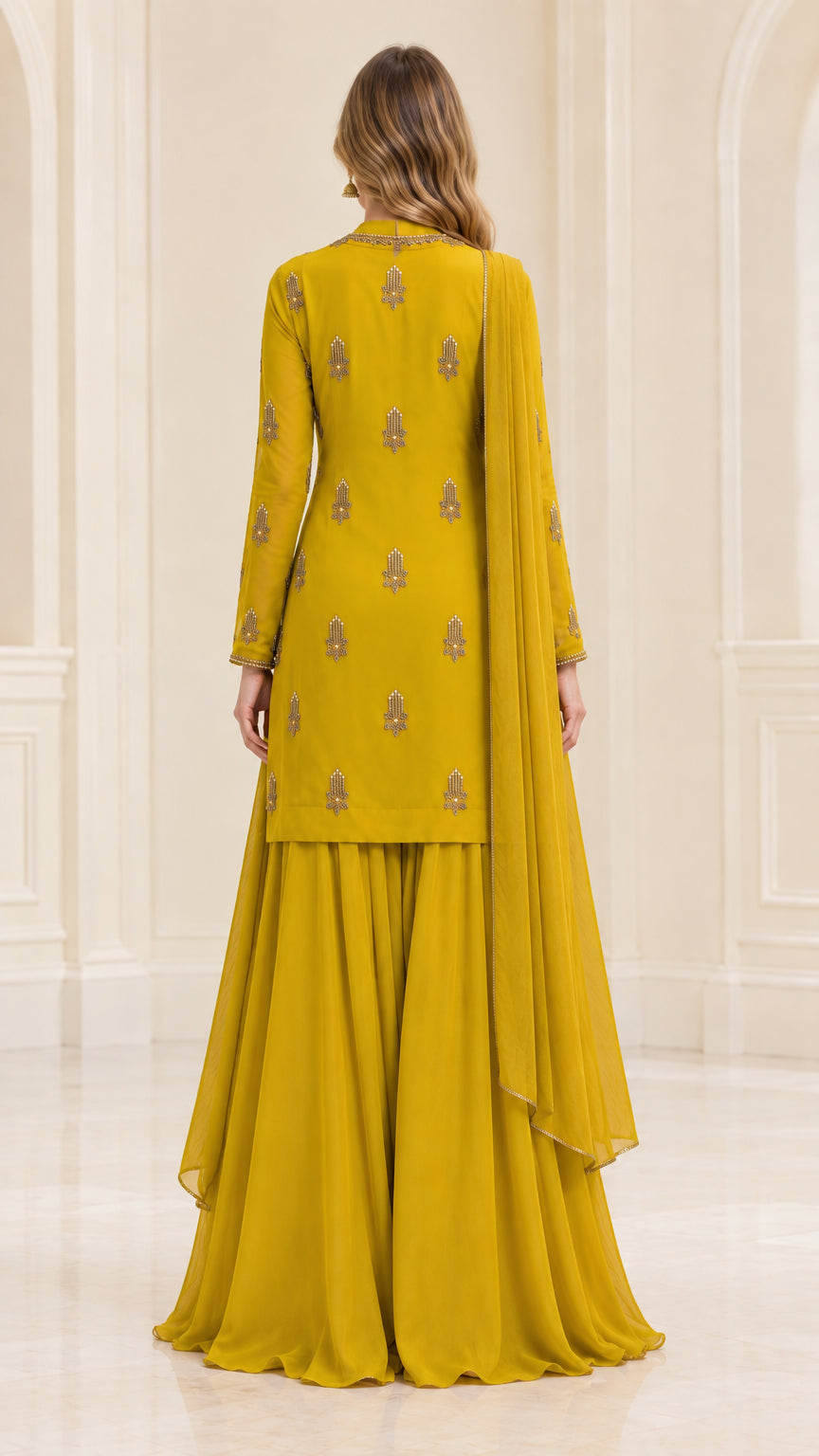 Back view of mustard yellow embroidered kurta and flared sharara pants