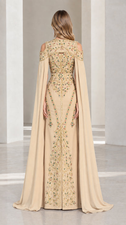 Champagne cape evening gown back view showing flowing cape detail