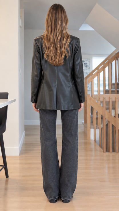 Back full-length view of Black faux leather blazer showing structured back vent