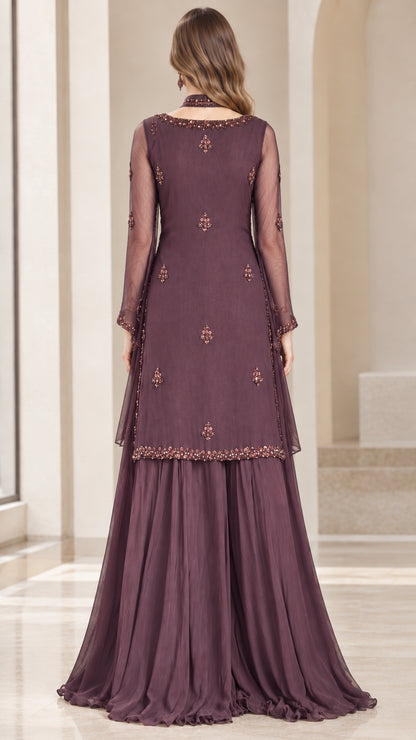 Back view of model wearing plum embellished evening tunic set