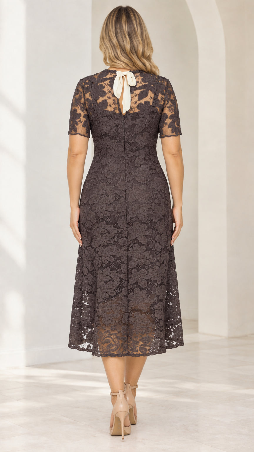 Back view of model showing back keyhole with white ribbon tie and back zipper