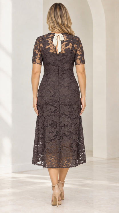 Back view of model showing back keyhole with white ribbon tie and back zipper