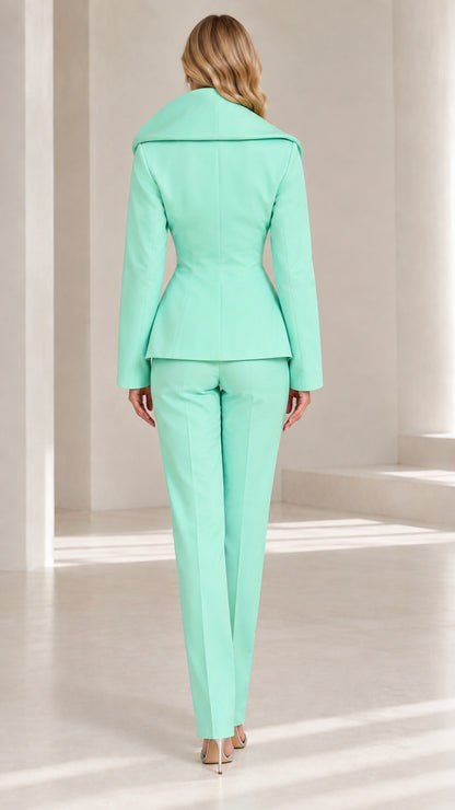 Back view of model showcasing the sculpted collar and tailored waist of Mint Green suit
