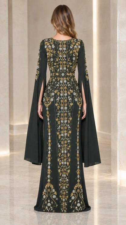 Back view of model in dark green embroidered formal evening gown
