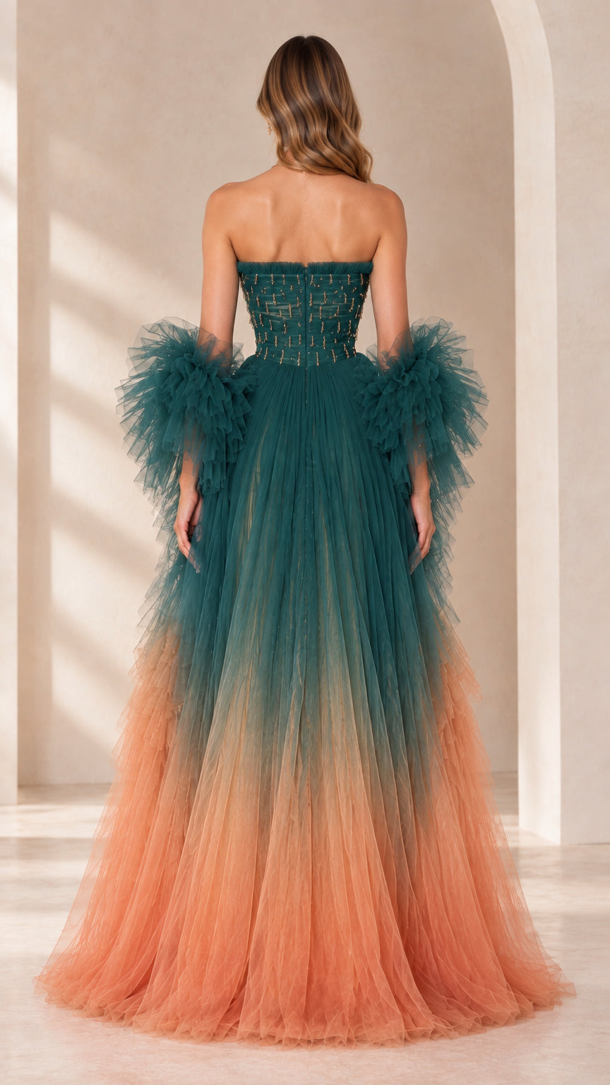 Back view of teal and peach ombre strapless beaded tulle formal dress